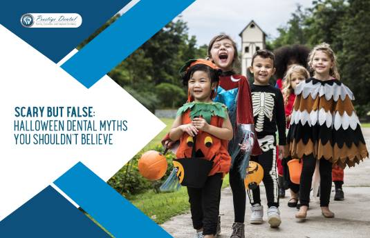Children in Halloween costumes smiling and walking outdoors with pumpkin-shaped candy containers, promoting dental health awareness with the message 'Scary but False: Halloween Dental Myths You Shouldn’t Believe' from Prestige Dental.